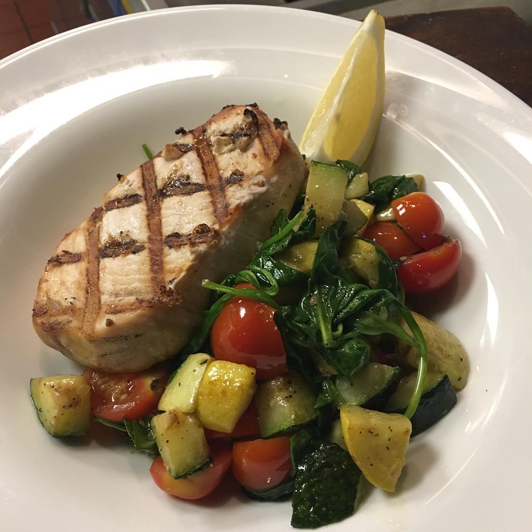 Lunch time Weekend Special while it lasts Grilled Swordfish and sautéed veggies served with a side salad