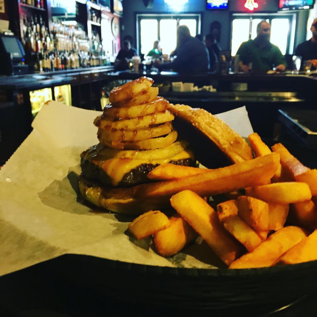 Have you tried the Beehive Burger yet Think cheddar cheese stacked onion rings and honey BBQ sauce cooked to your liking Burgers are BOGO from 12pm 2pm Monday through Friday sports bar restaurant waltham ma