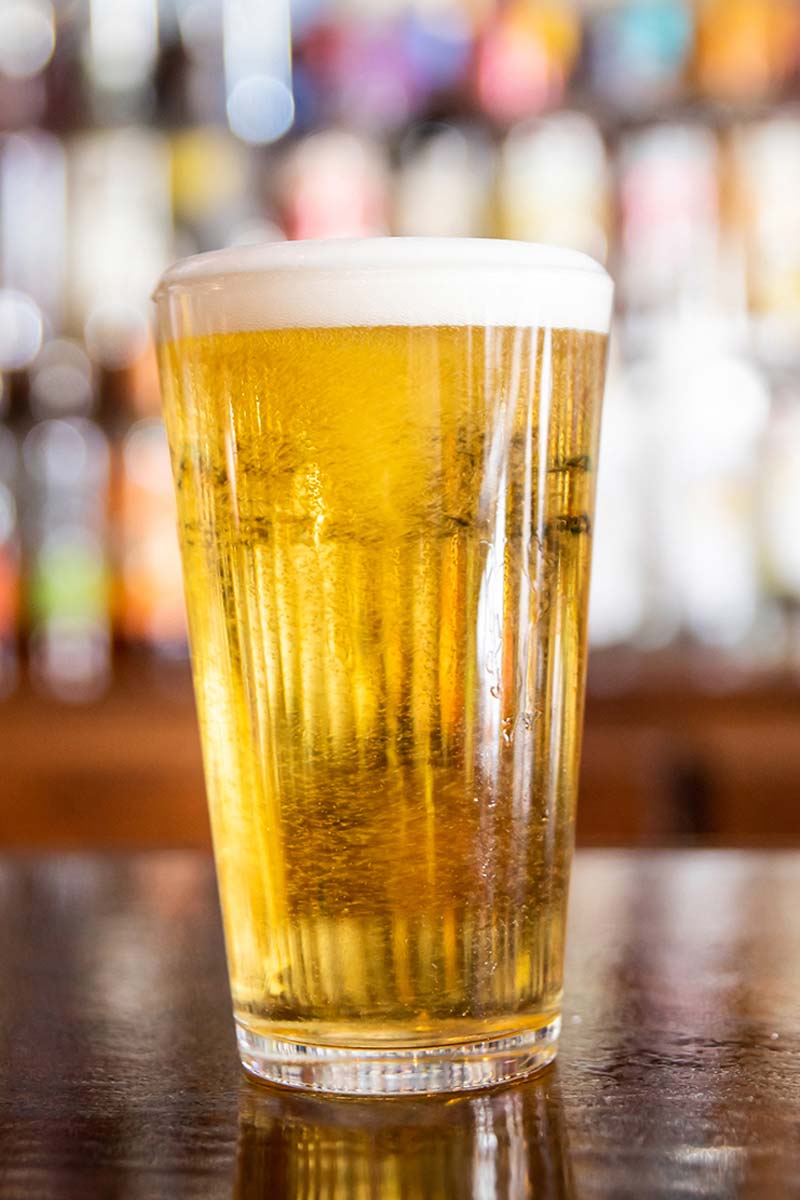 pilsner beer glass on bar